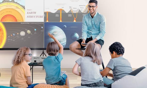 A teacher having a group discussion with 4 students
